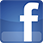 Ein kleines blaues quadratisches Symbol mit einem kleinen weißen „f“ darauf, das das Facebook-Logo darstellt.